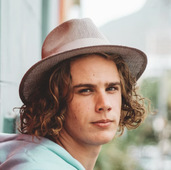 Young man wearing fedora